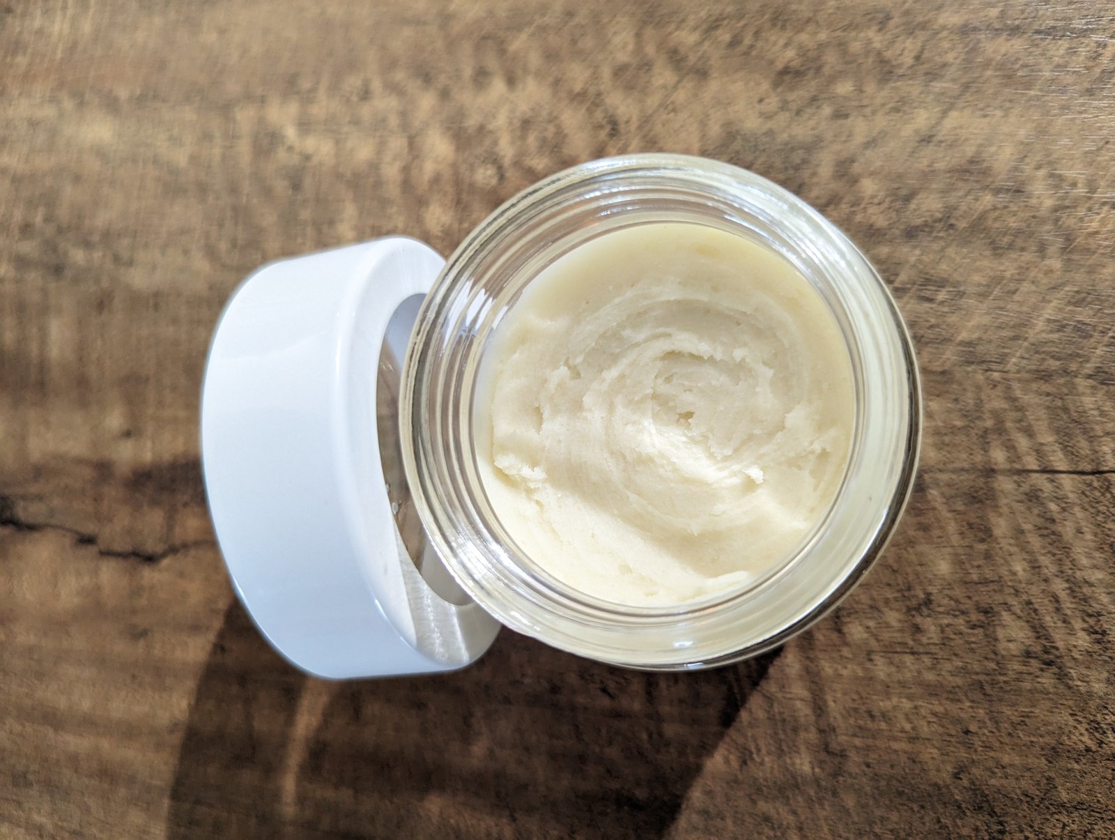 Homemade natural deodorant ingredients including arrowroot powder, jojoba oil, and beeswax