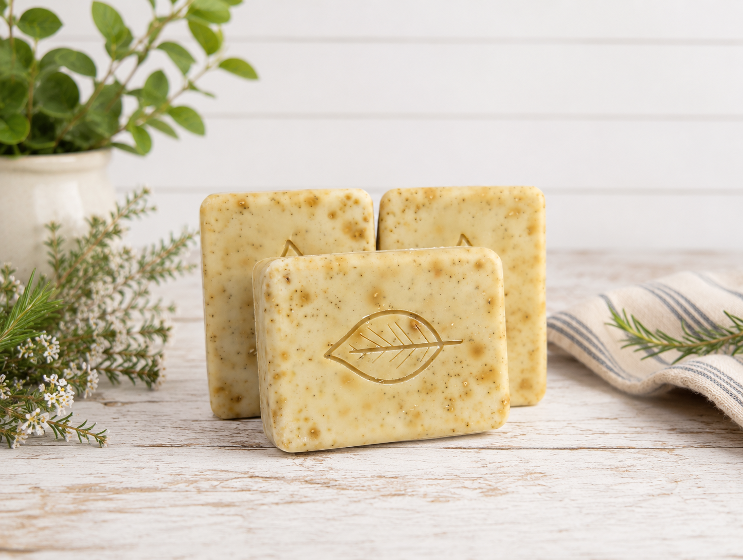 Handmade soap bars curing on a wooden drying rack